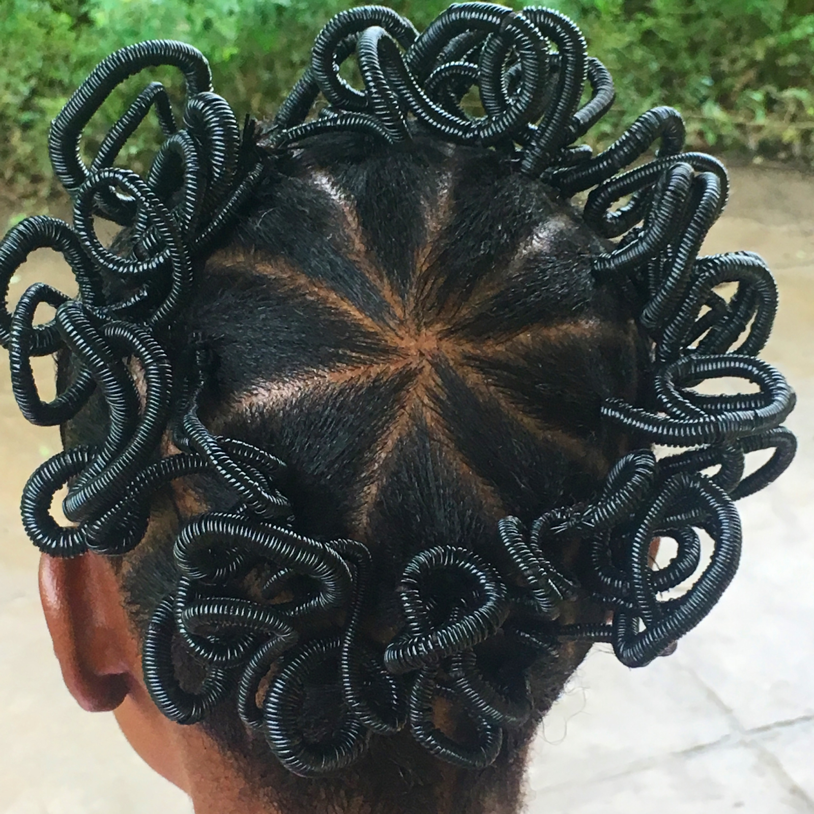 Young lady with African threaded hair.