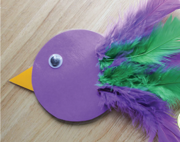 Cut out bird with colored feathers 