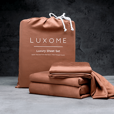 Luxome sheet set in terracotta brown color.
