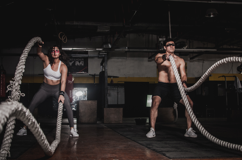 https://www.pexels.com/photo/man-and-woman-holding-battle-ropes-1552242/
