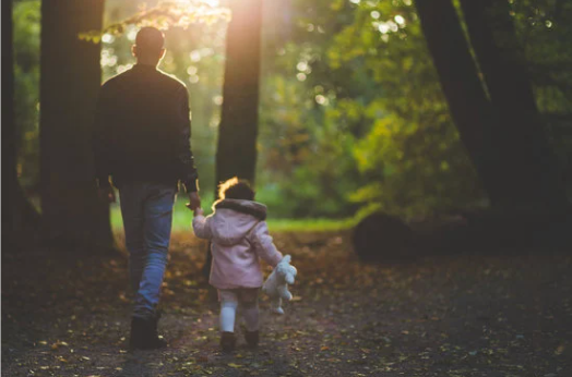 parent and child walking in forest. St. Petersburg Wrongful Death Attorney