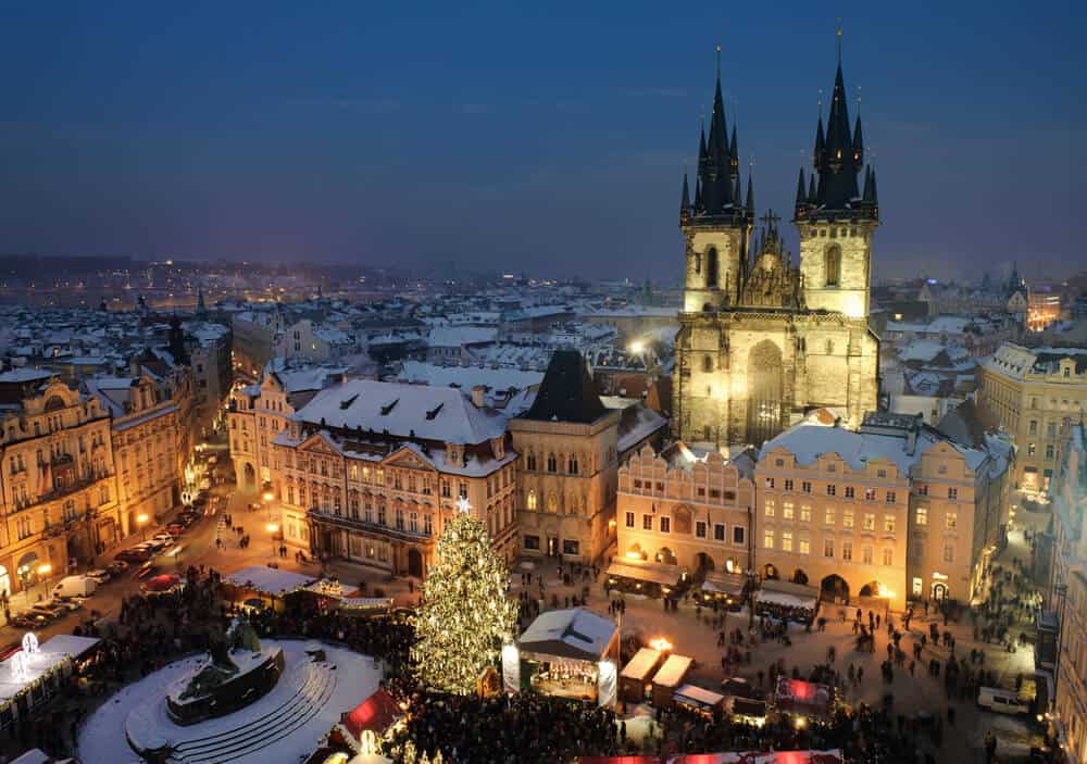 city of prague at night during the holidays