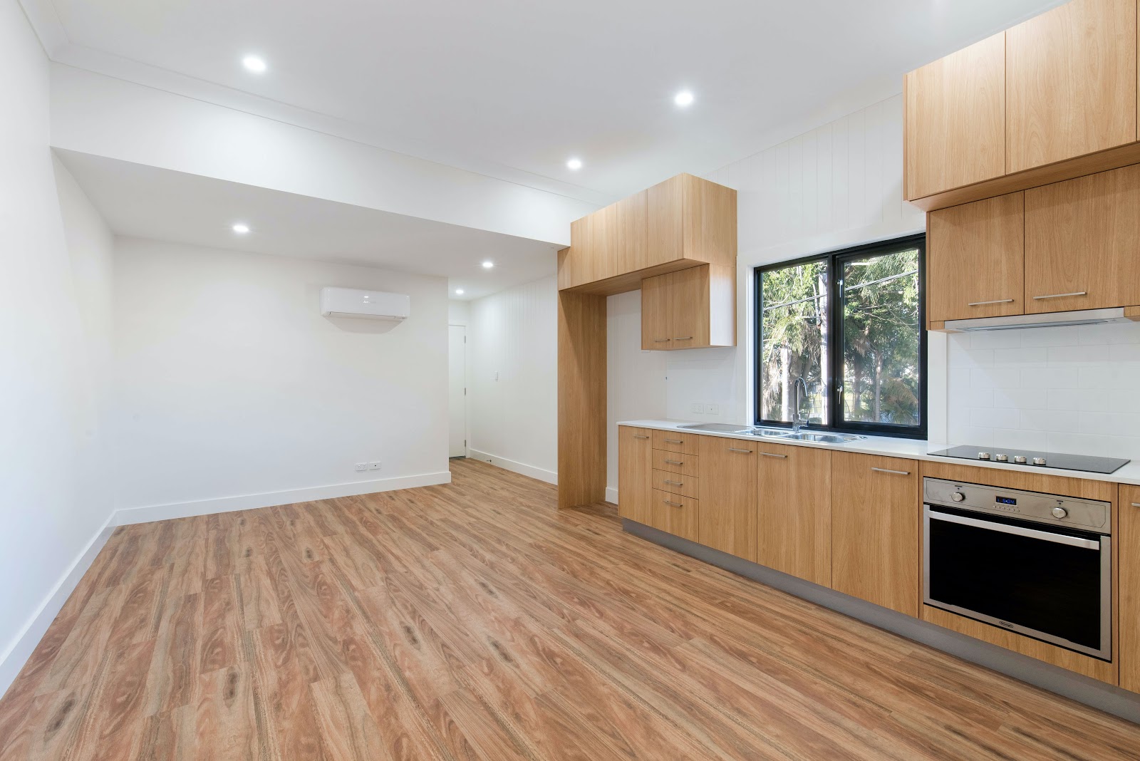 Empty kitchen with wood floors