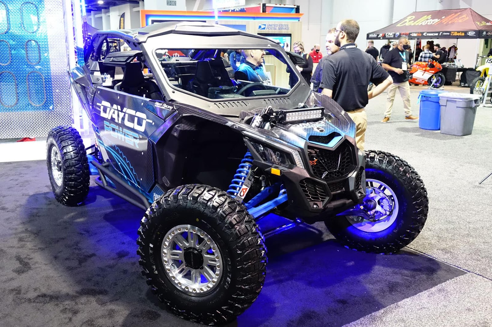 Custom side-by-side with neon underglow lighting showcased at AIMExpo trade show