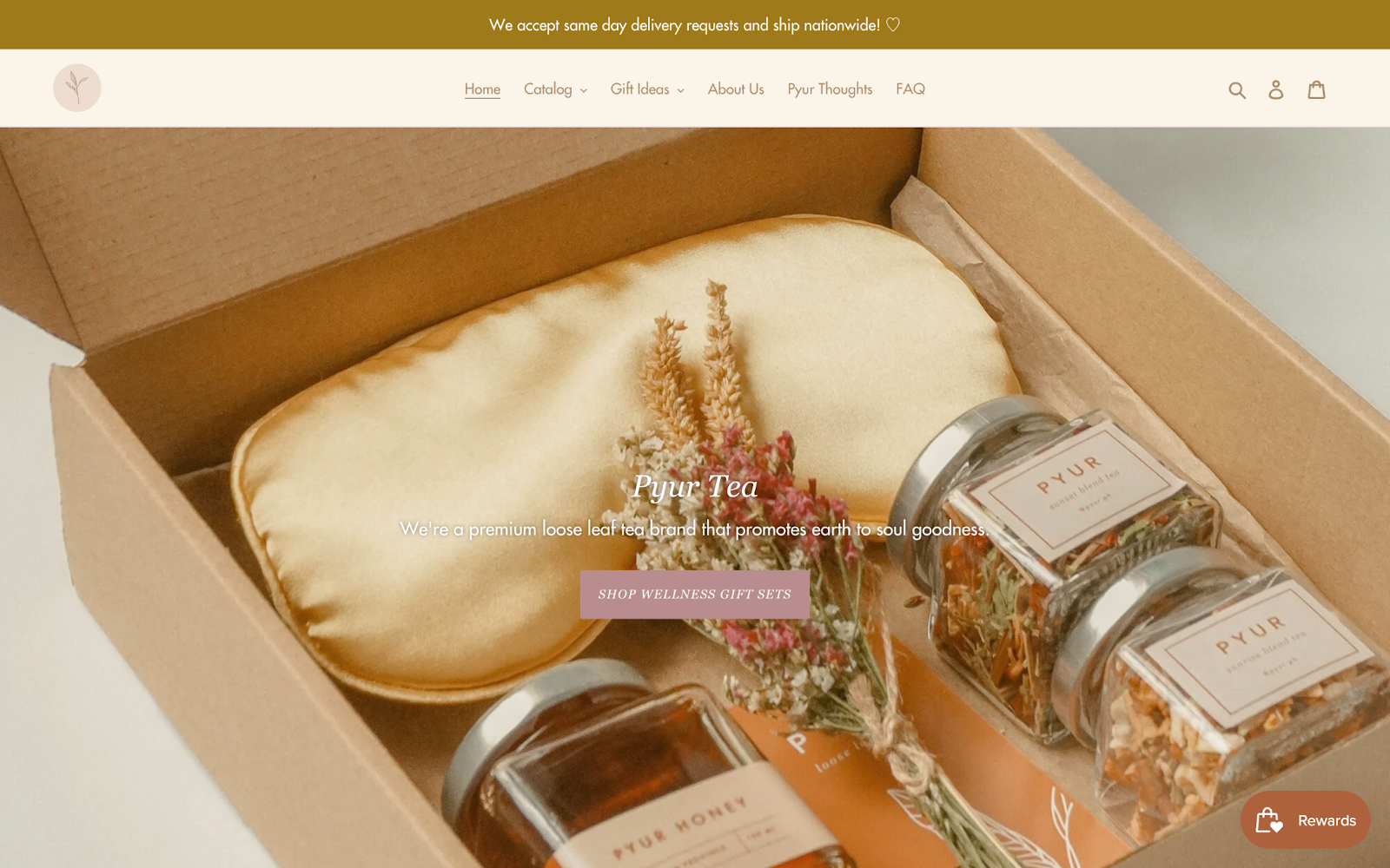 Mental Wellness Brands for World Mental Health Day–A screenshot of Pyur Tea’s homepage. The feature image is a box with 3 jars of loose leaf tea, a bouquet of wildflowers, and a gold silk eye mask. 