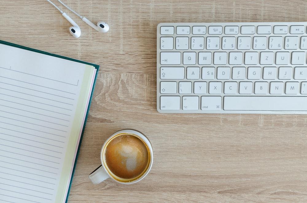 Table with study materials and a coffee