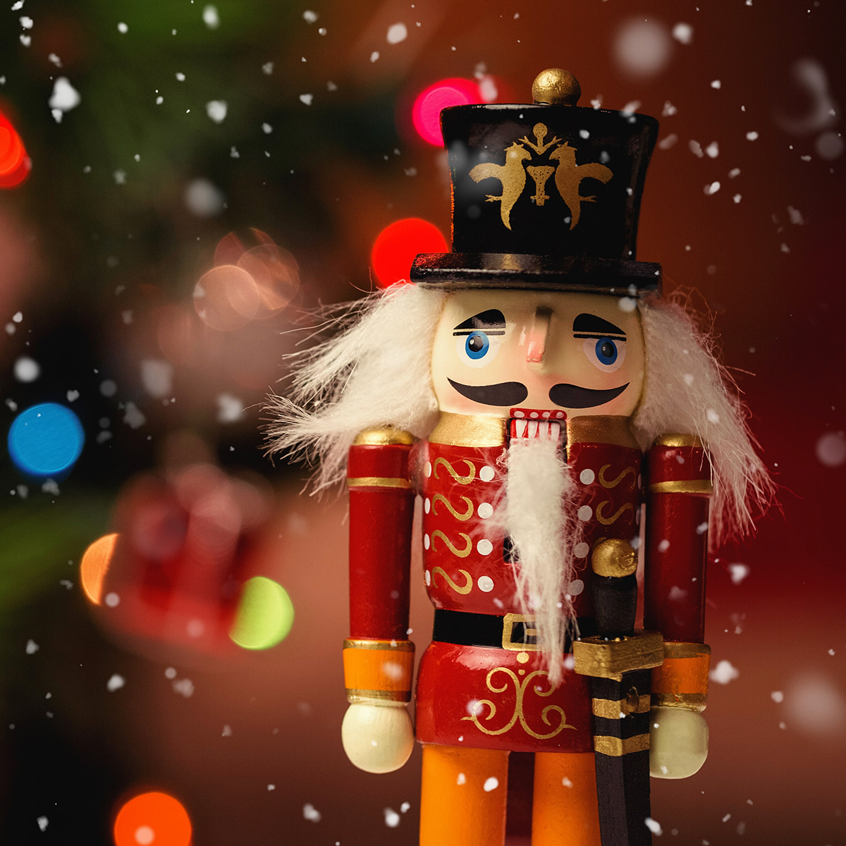 wooden nutcracker with red uniform and tall black hat