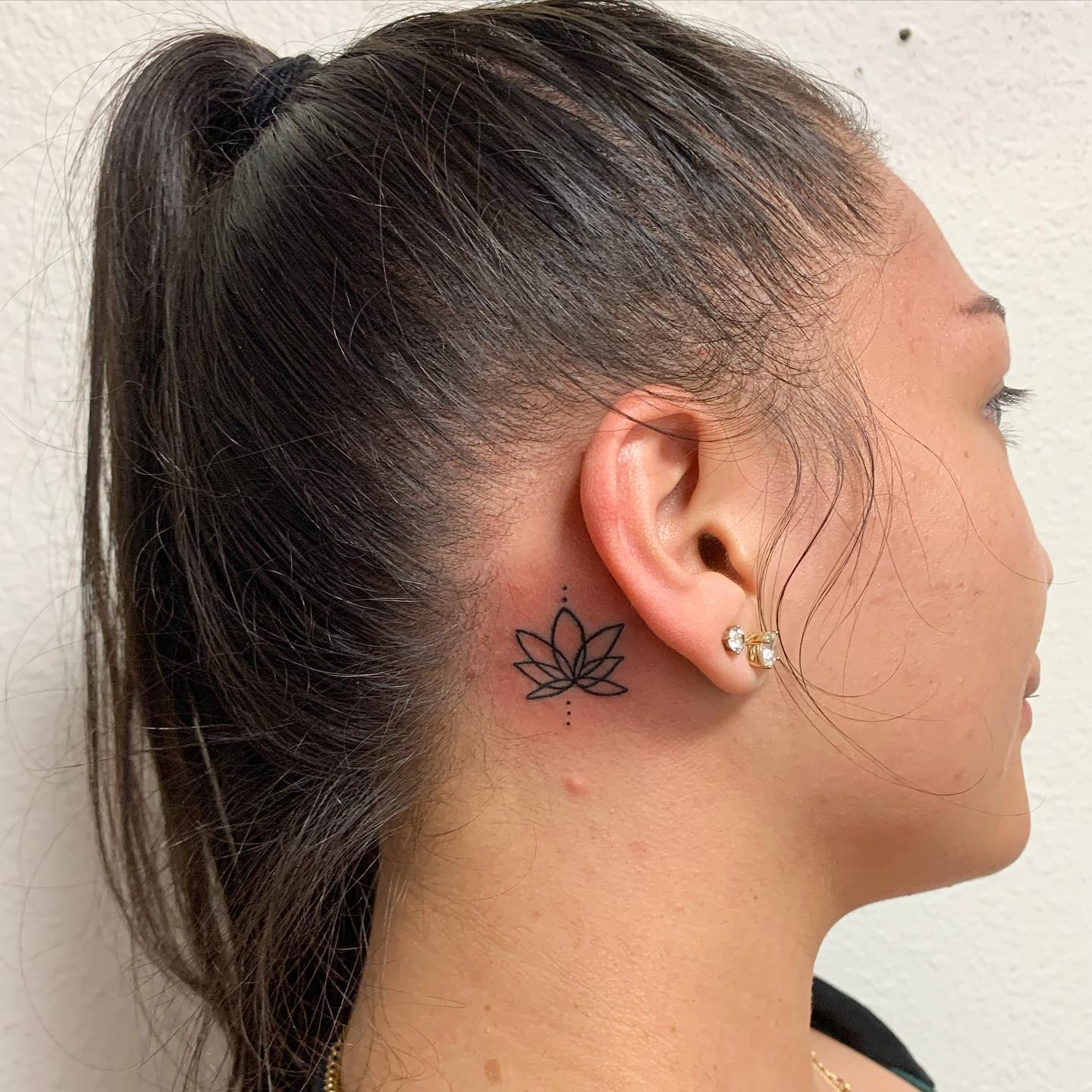 Linework Lotus Behind The Ear Tattoo