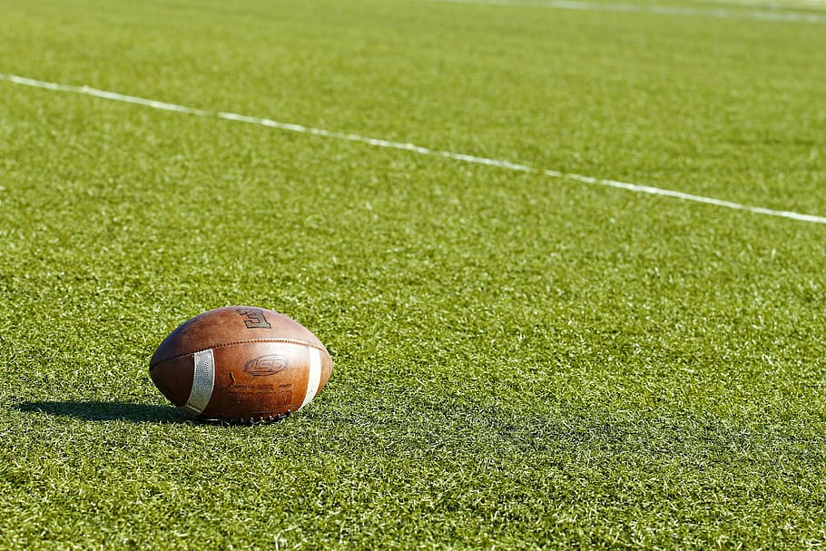 image of a football on grass field