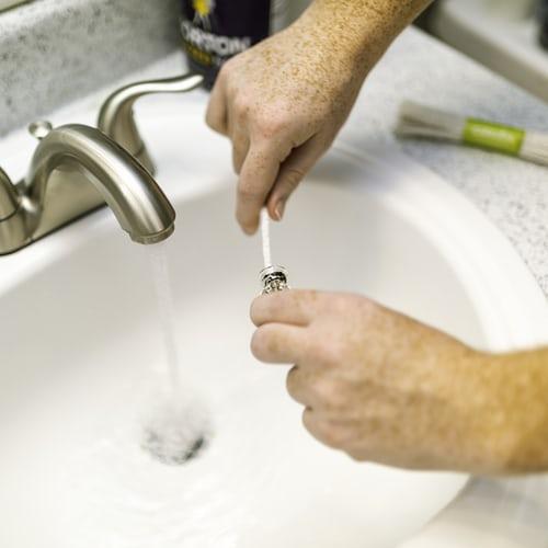  plumber repairing a sink