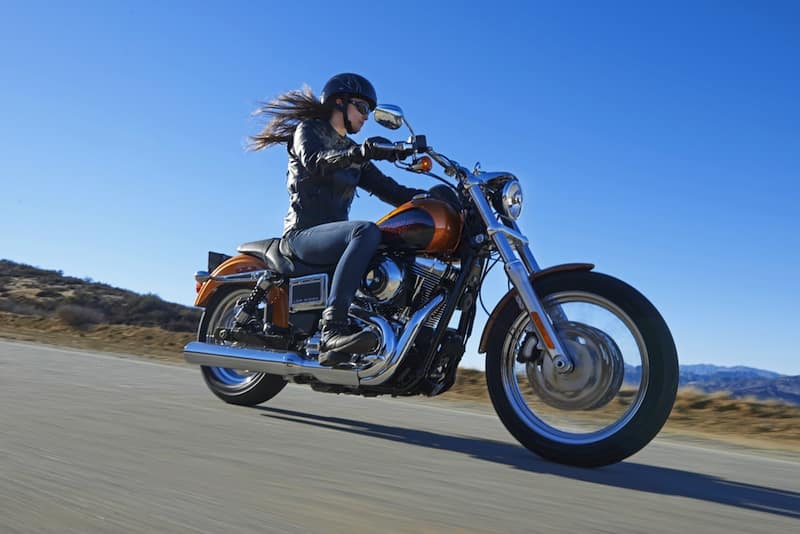 Female motorcyclist enjoying ride with her hair in the wind