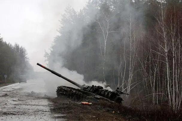 PHOTO: Smoke rises from a Russian tank destroyed by the Ukrainian forces on the side of a road in Lugansk region on Feb. 26, 2022. (Anatolii Stepanov/AFP via Getty Images)