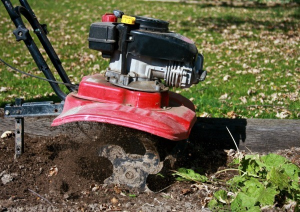 a close-up picture of a tiller causing soil erosion