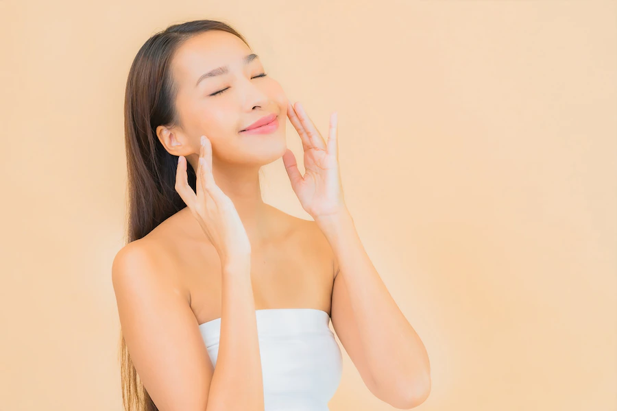 A person with the hand on the faceDescription automatically generated with medium confidence