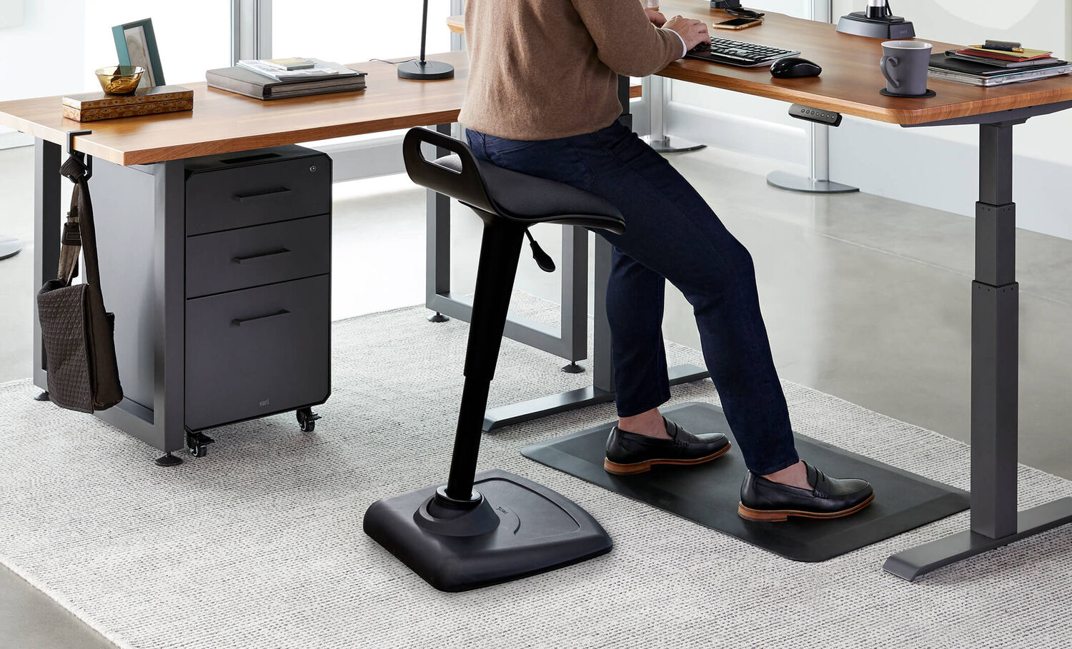 A person sitting on an active chair.