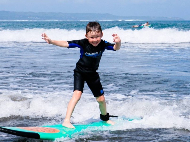 child on the board.surfing
