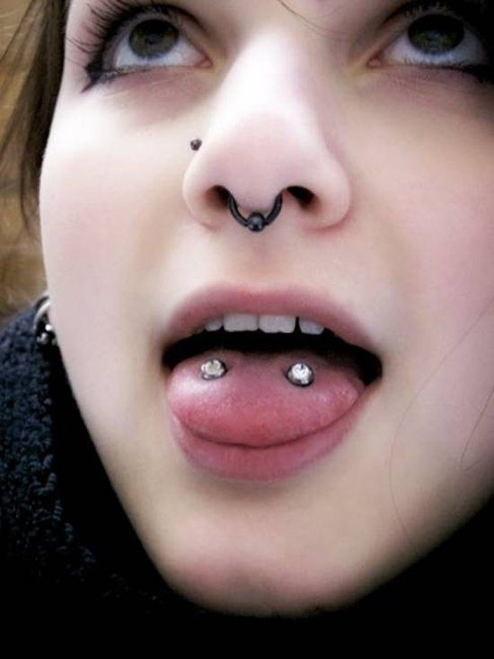 Close up view of a lady rocking the venom piercing 