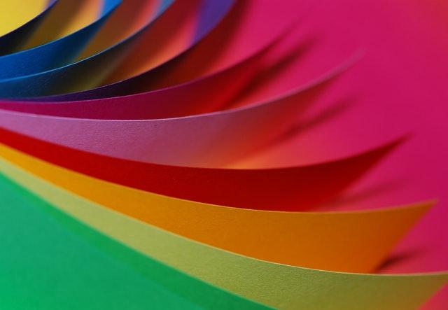 Papers showing an array of colors, representing qualities of a great painting company website.