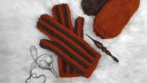 One piece mittens on white fur background