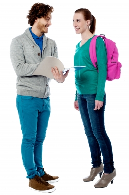 young man holding notebook and young woman carrying backpack