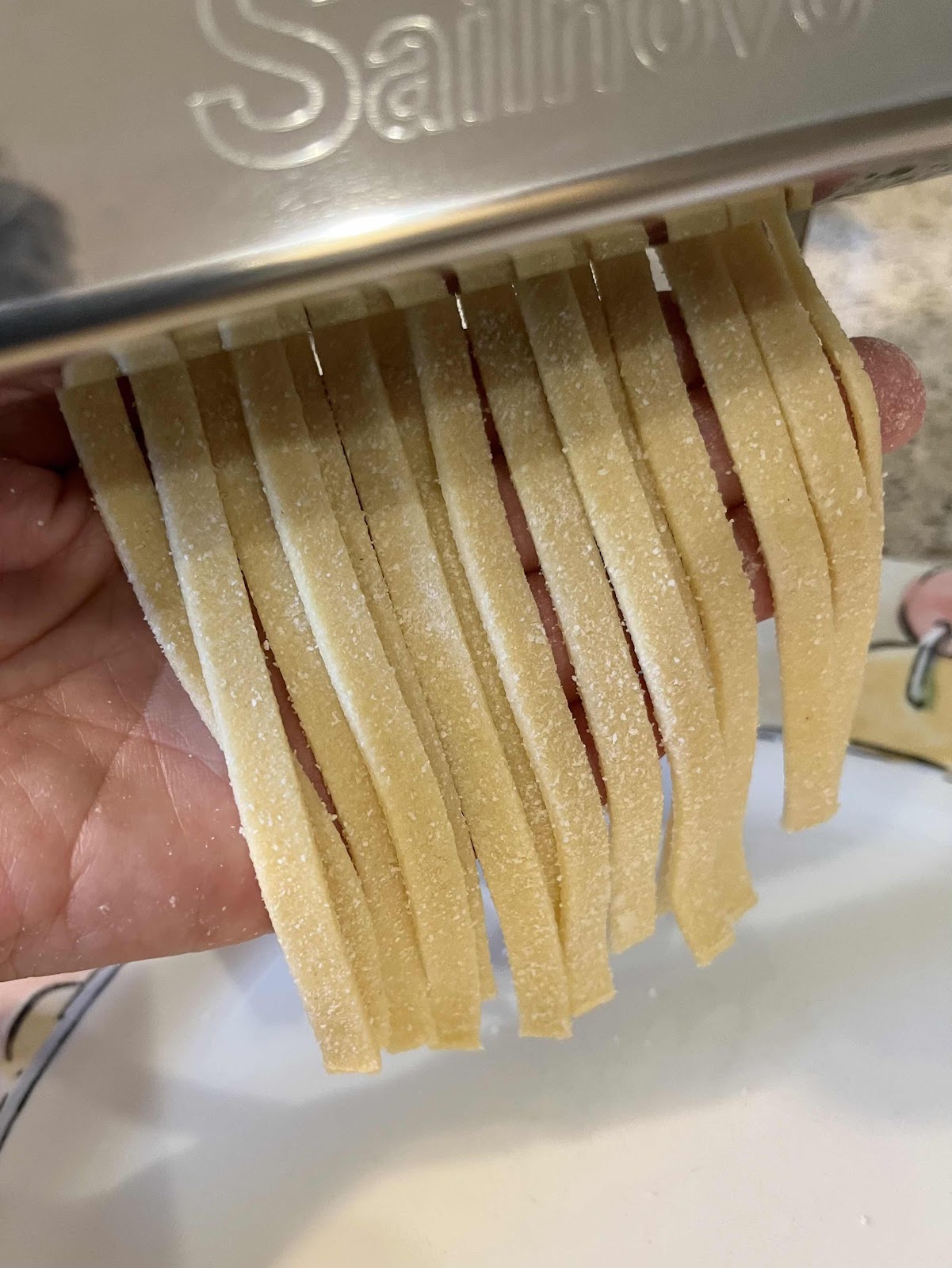 Cut the dough into fettuccine noodles