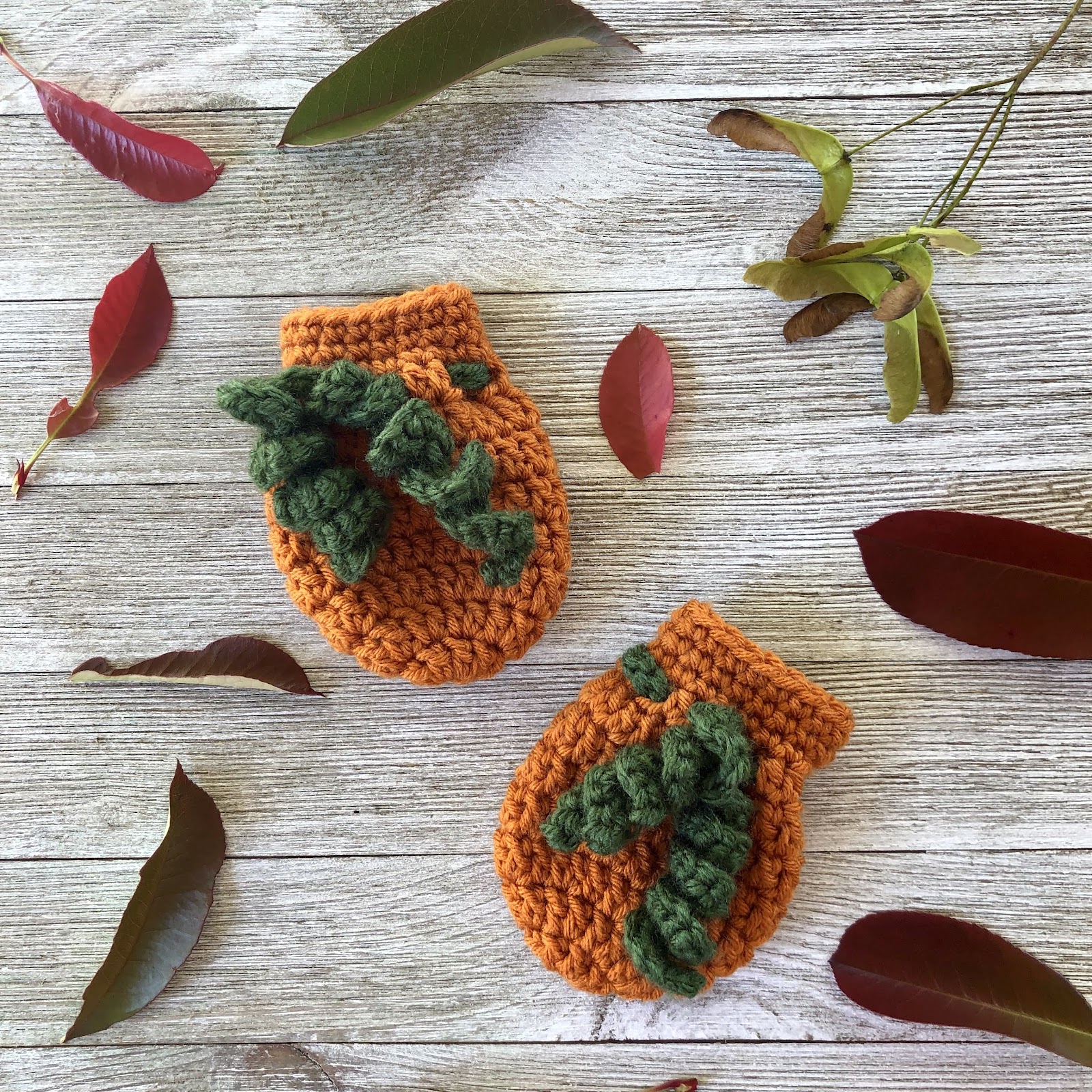 Crochet pumpkin baby mittens pattern by www.itchinforsomestitchin.com