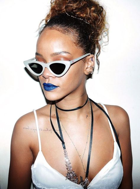 Rihanna wearing fancy sunglasses with blue lipstick