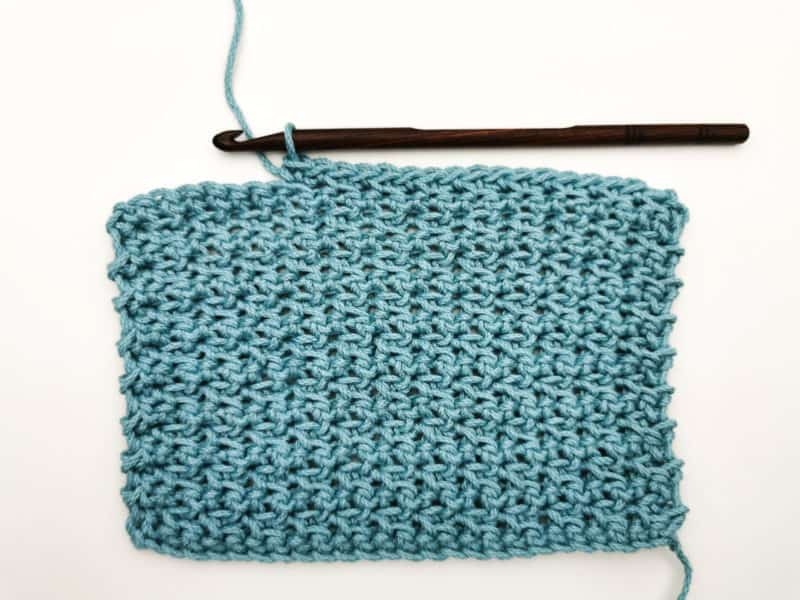 front and back loop single crochet swatch with hook on white background