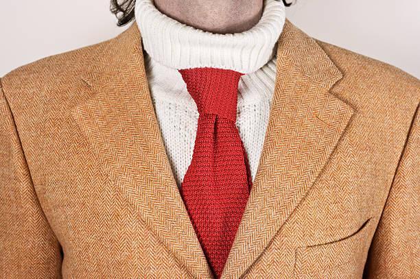 Unconventional elegance for cold winters A silk necktie improperly worn over a turtleneck sweater. wool ties stock pictures, royalty-free photos & images