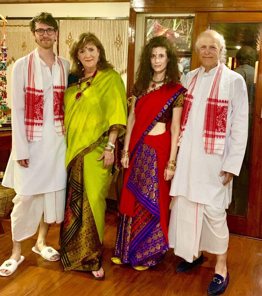 passengers in traditional Assamese clothes