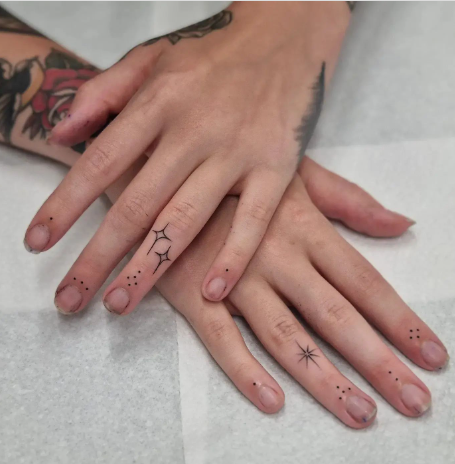 Small Finger Star Tattoo