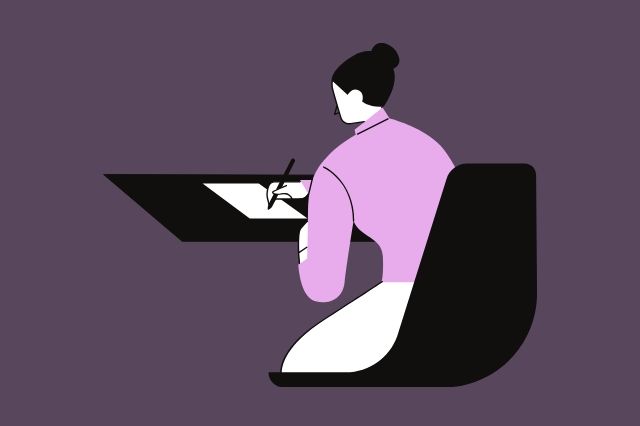 Woman writing at a desk.