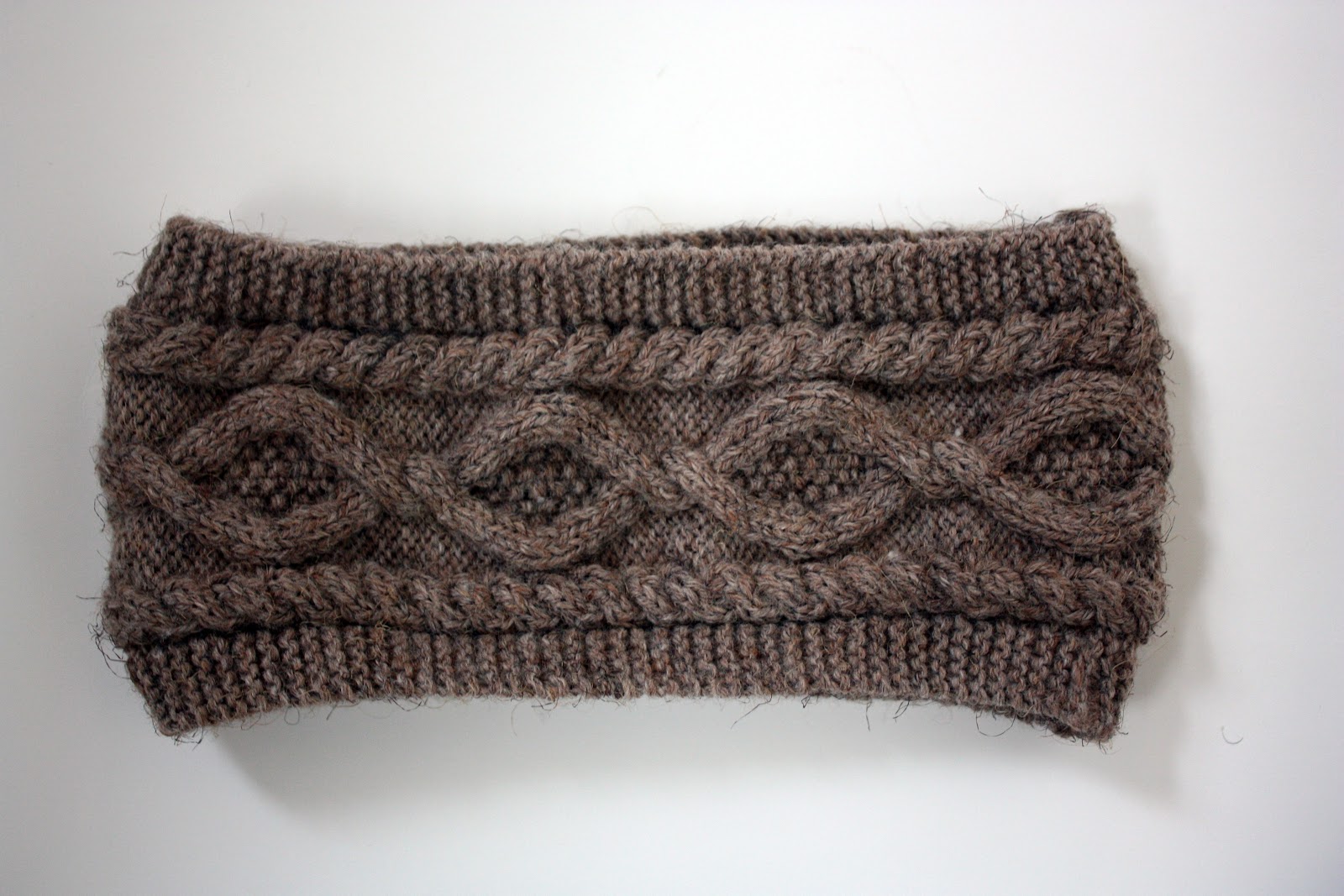 brown headband showing knitting pattern