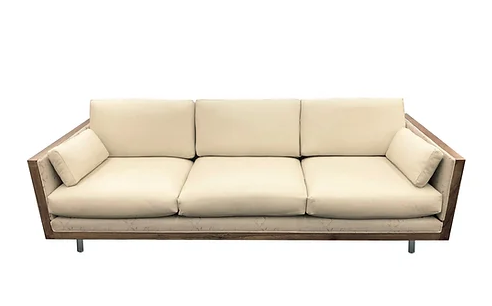 cream colored mid mod couch with tapered legs
