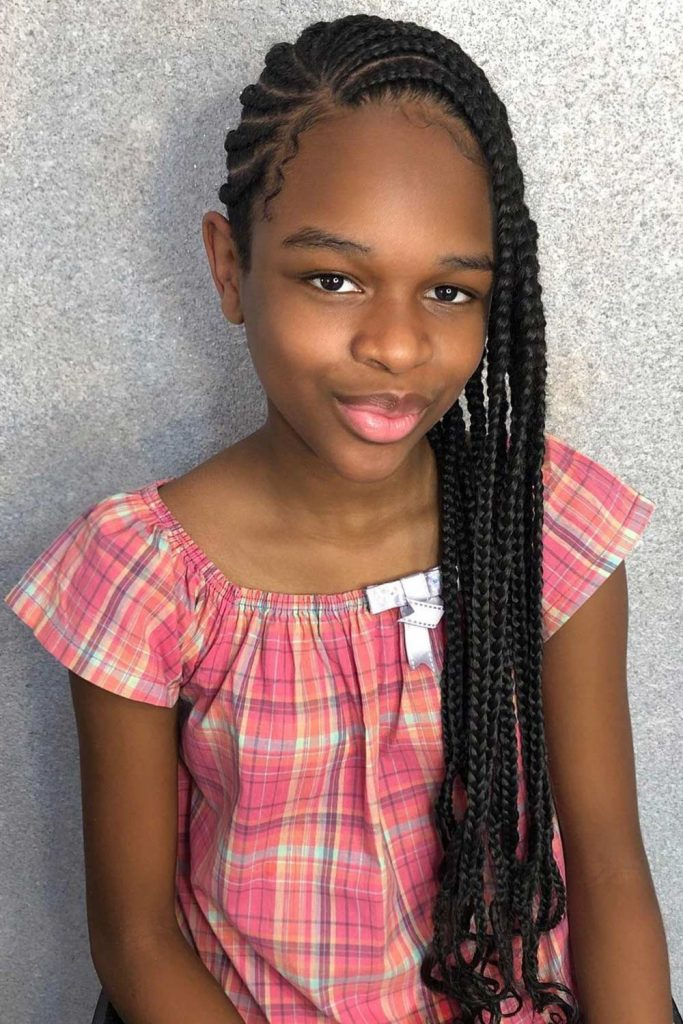Full picture of a girl showing off her long lemonade braids