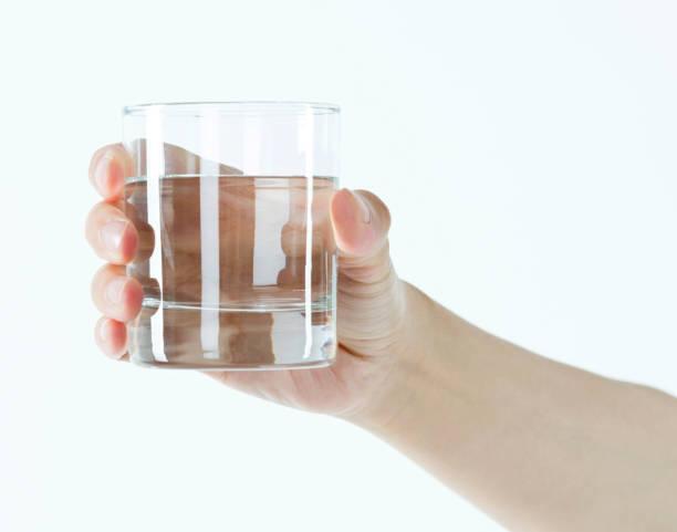 23,400+ Hand Holding Glass Of Water Stock Photos, Pictures & Royalty-Free  Images - iStock | Hand glass of water, Drinking water, Holding up glass