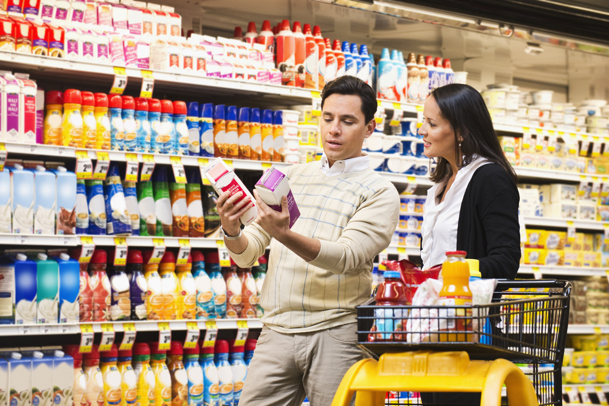 An image of shoppers at a store demonstrating the contrast principle in persuasive frames