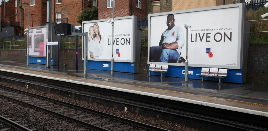 Outdoor advertising either in railway stations or along station platforms, as seen in this image, is a great way to get commuter attention.